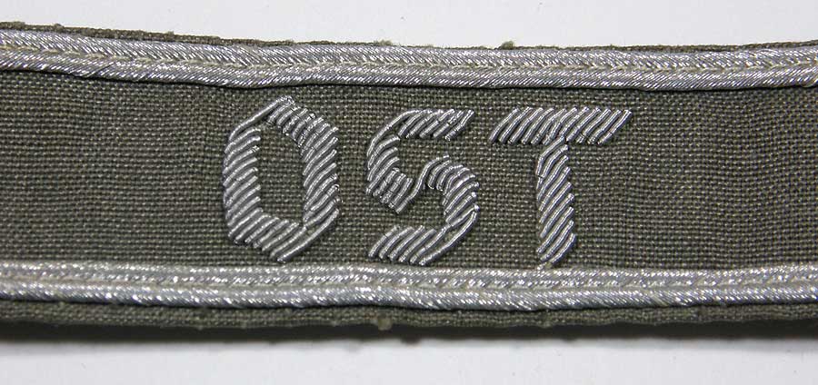OST cufftitle in hand-embroidered aluminum wire with silver borders